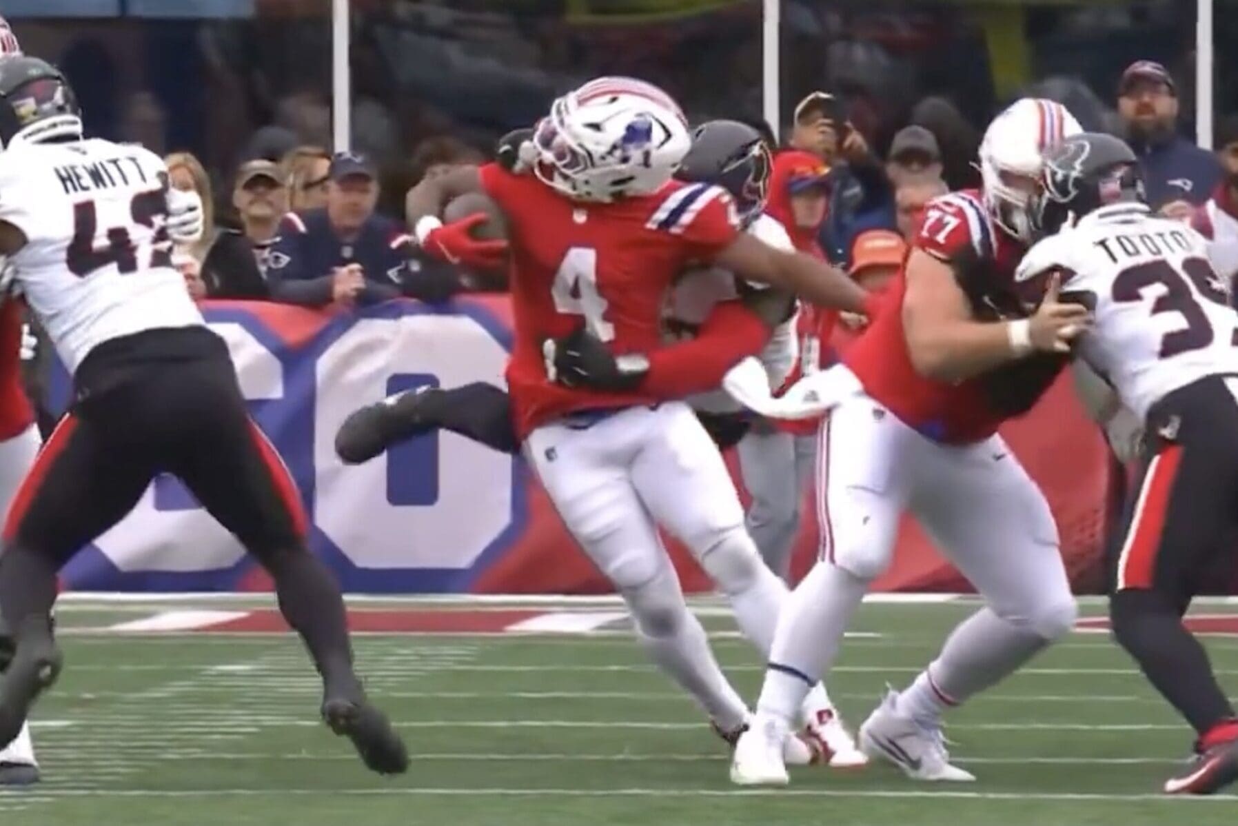 New England Patriots running back Antonio Gibson gets brought down by his facemask against the Houston Texans. No penalty was called.